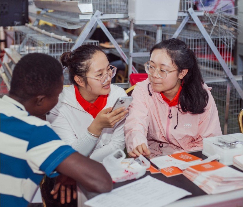International participants discussing business at an exhibition table
