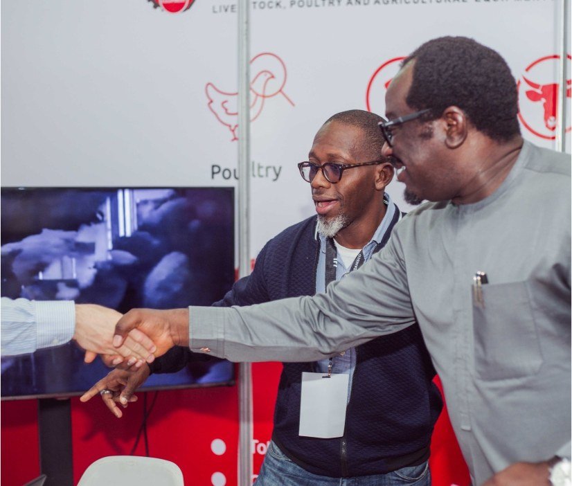 Participants reviewing a product display at an exhibition