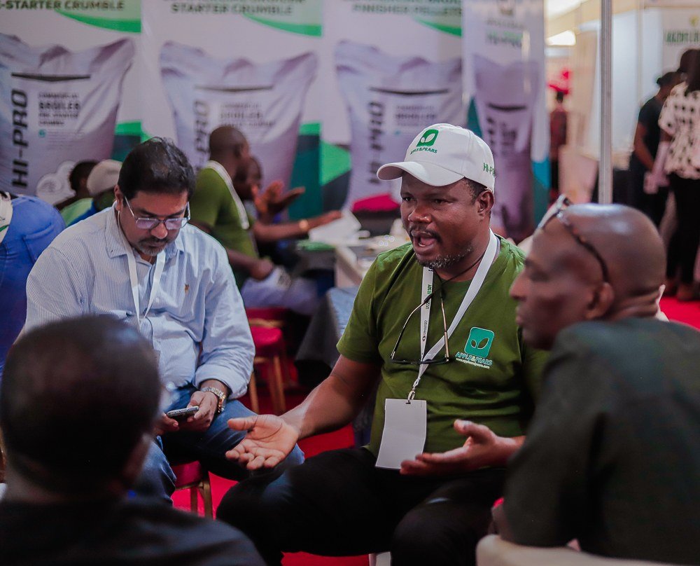 Participants conversing at a stand