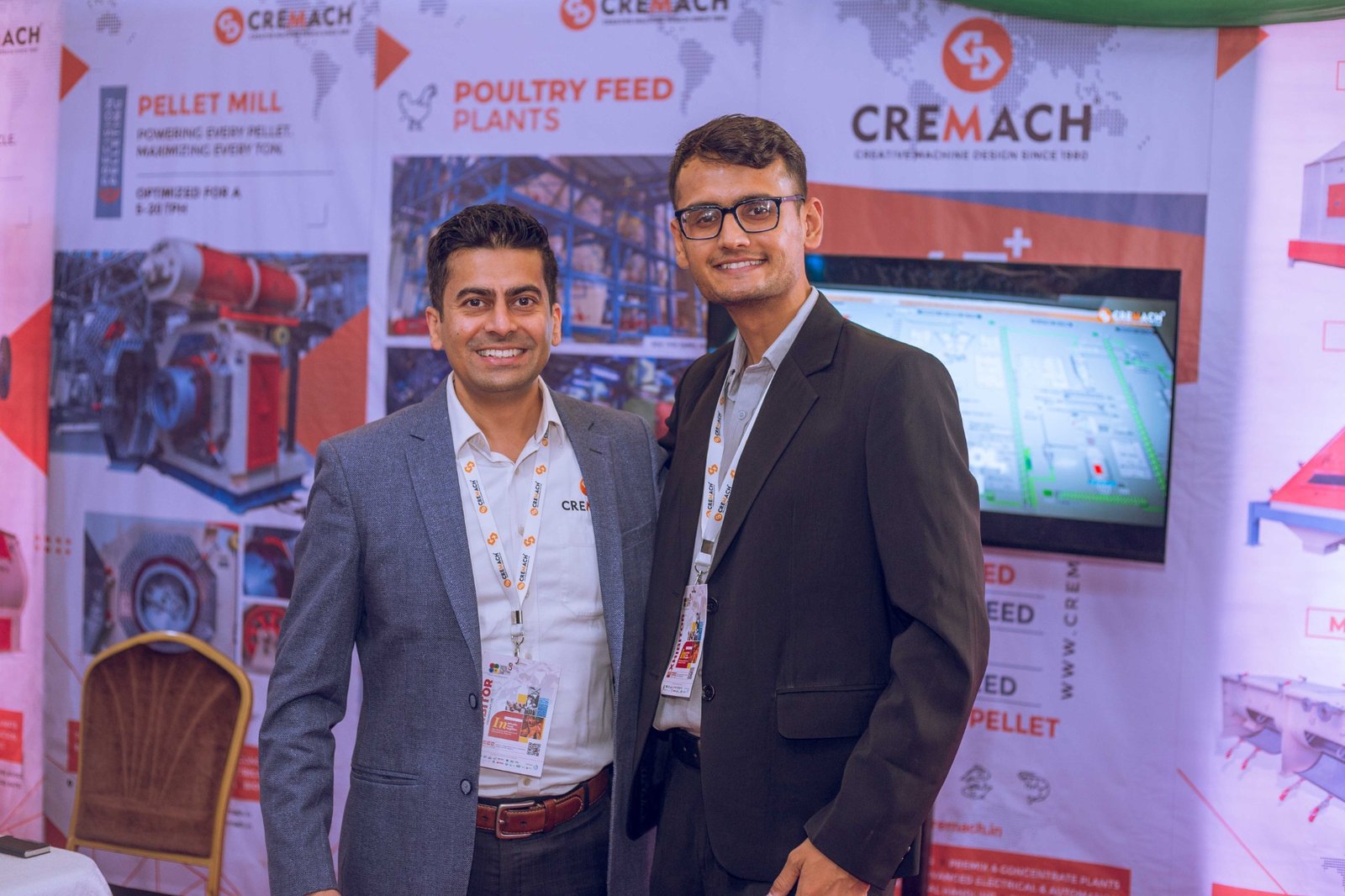 Exhibition participants at a feed technology display.